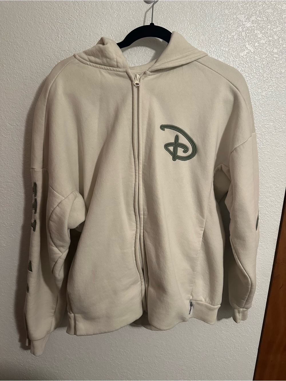 Disney Cream Full-Zip Hoodie with olive Green Logo